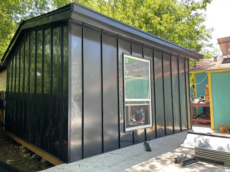 Black standing seam metal wall panels for Roof Inspection in Crandall