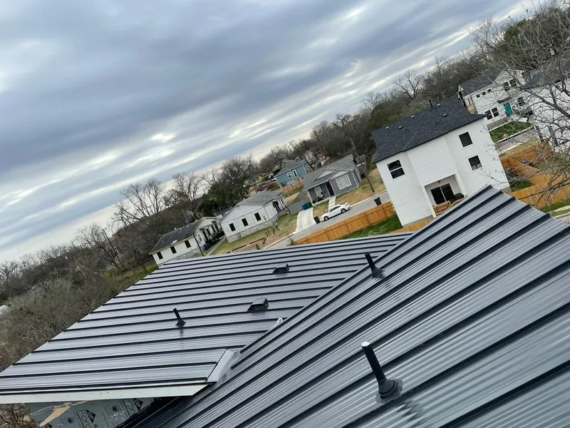 Standing seam metal roof panels with vents for Skylight Repair in Crandall